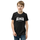 Preteen model wearing a Aloha Tribe Hawaii T-shirt that has a Hawaii themed graphic logo on the front.